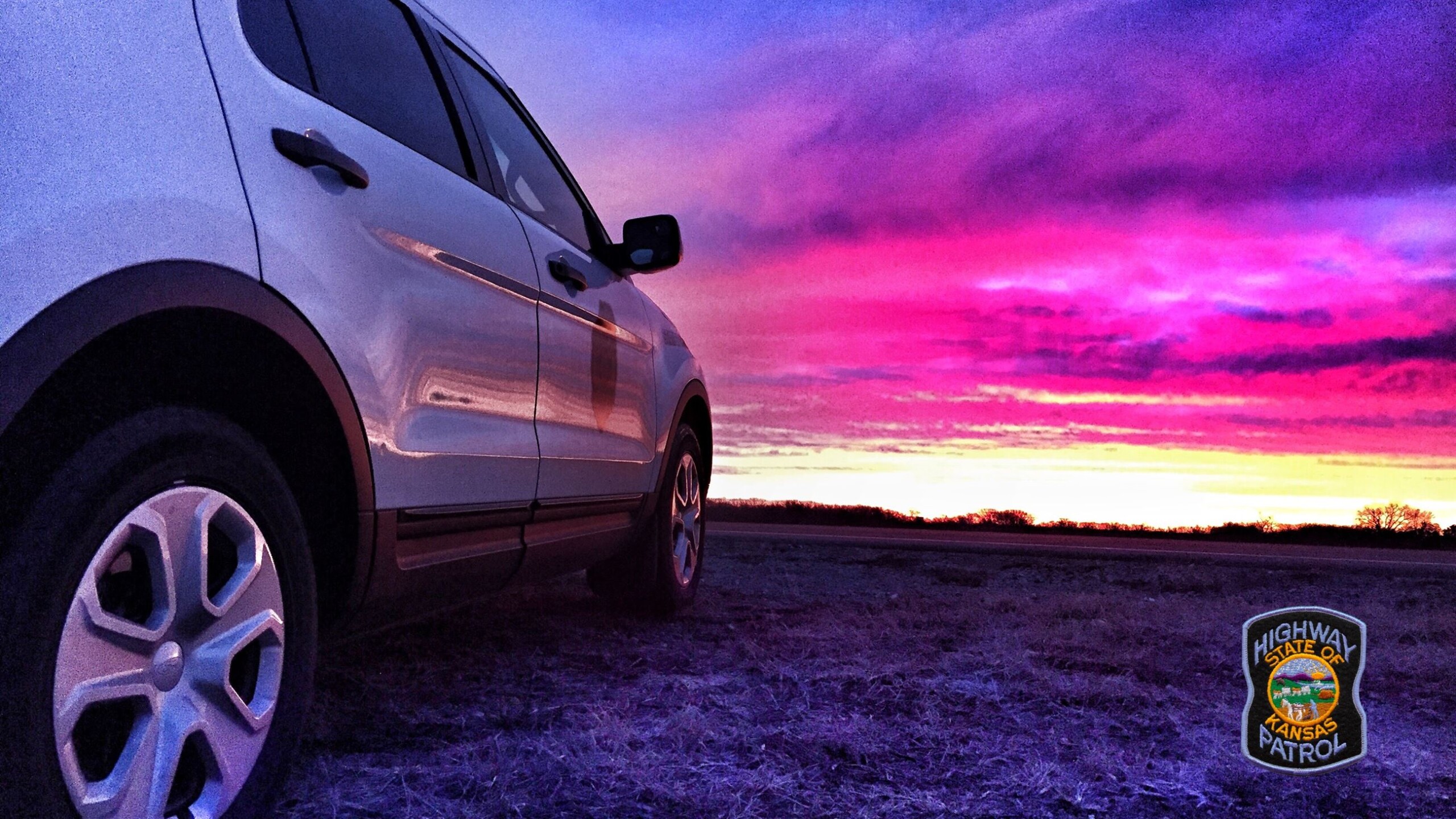 image of Patrol car and vivid sunset