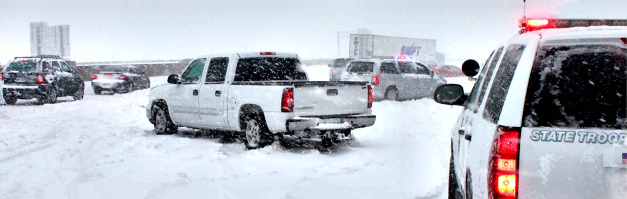 Highway with vehicles stuck in the snow