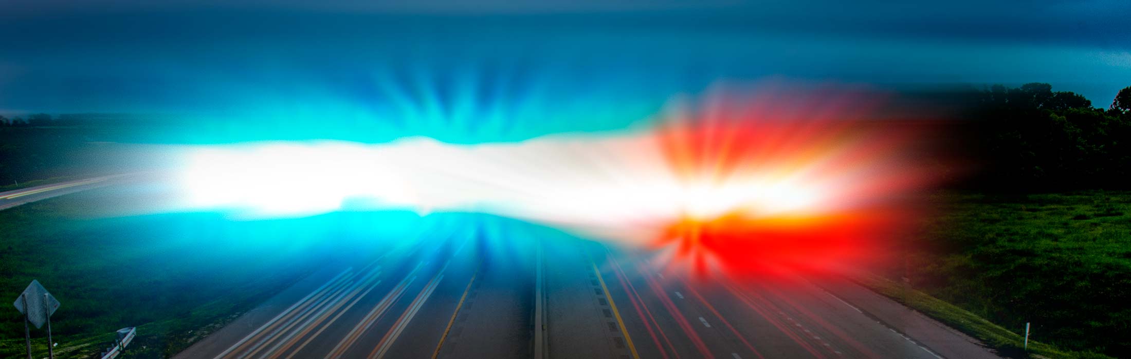 image of blue and red lights over a highway