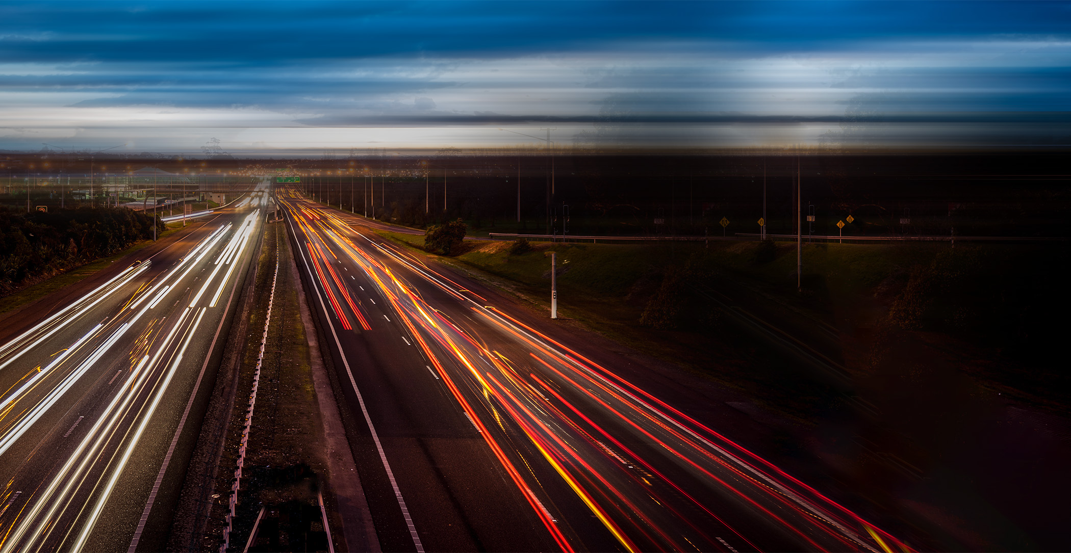 time elapse metro highway at night with headlights and tail lights.