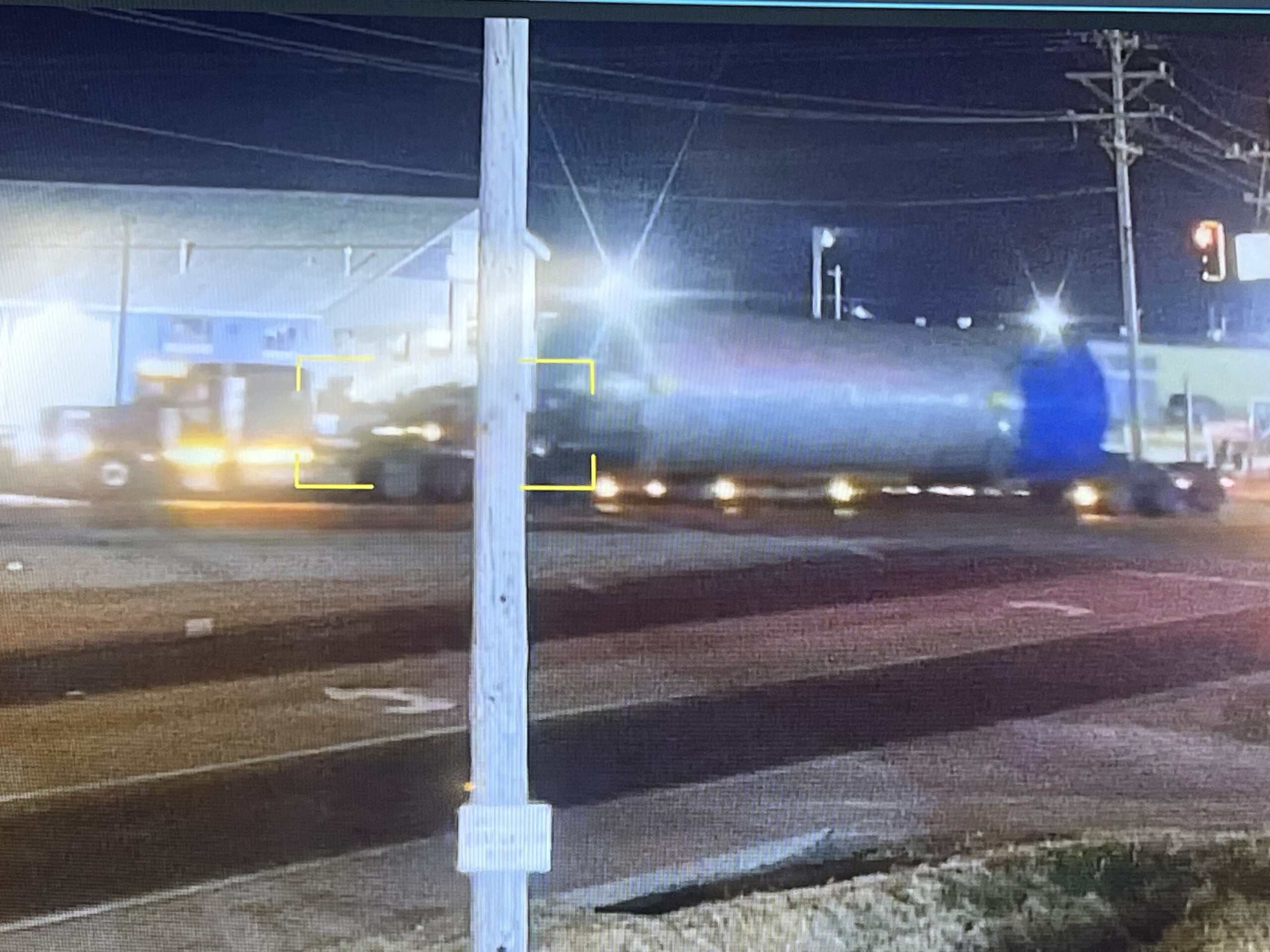 Security camera image of semi-truck hauling an oversized steel cylinder