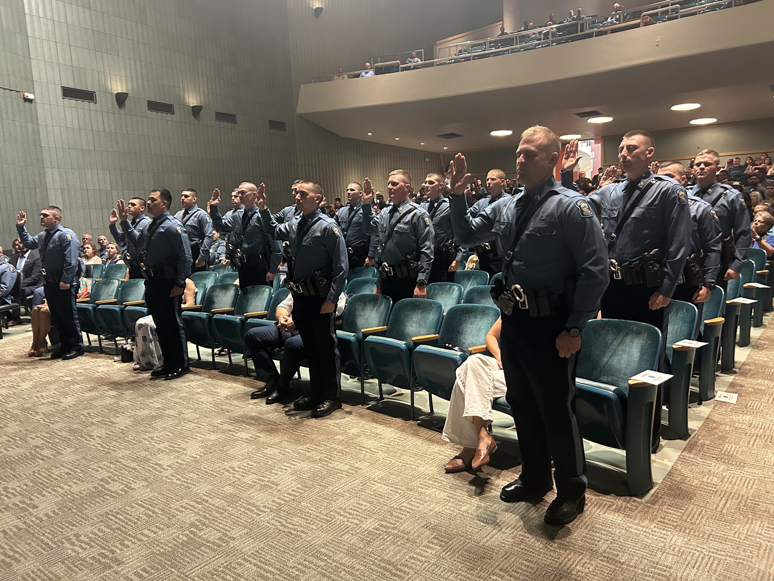 IMG_4400 The 16 Trooper Trainees standing with their right hand raised taking their Oath of Office as Class 75 graduation.